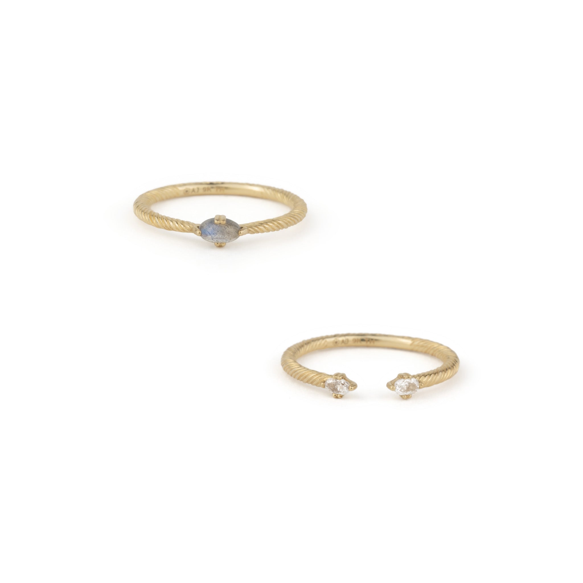 Solid gold ring stack set, featuring twisted texture, labradorite, and white sapphire, displayed on a white background.