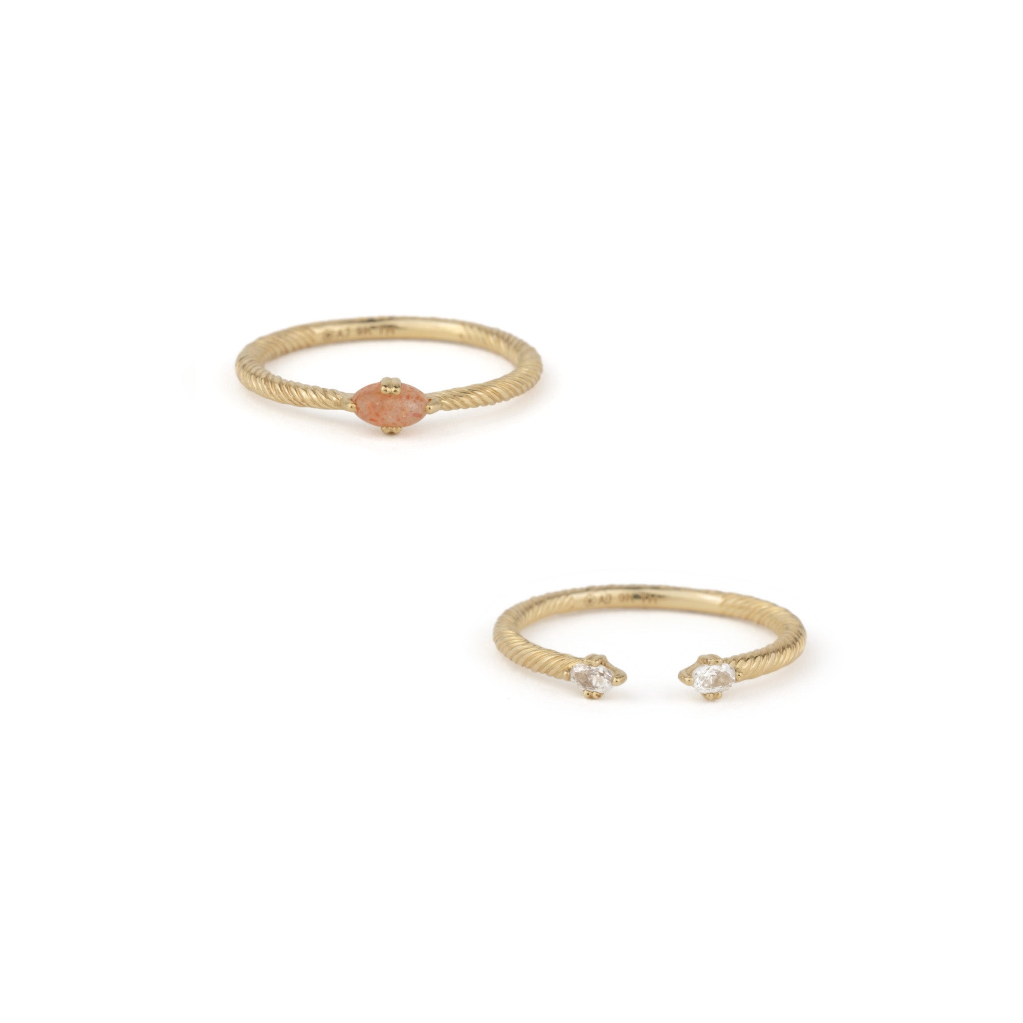 Solid gold ring stack set, featuring twisted texture, sunstone, and white sapphire, displayed on a white background.