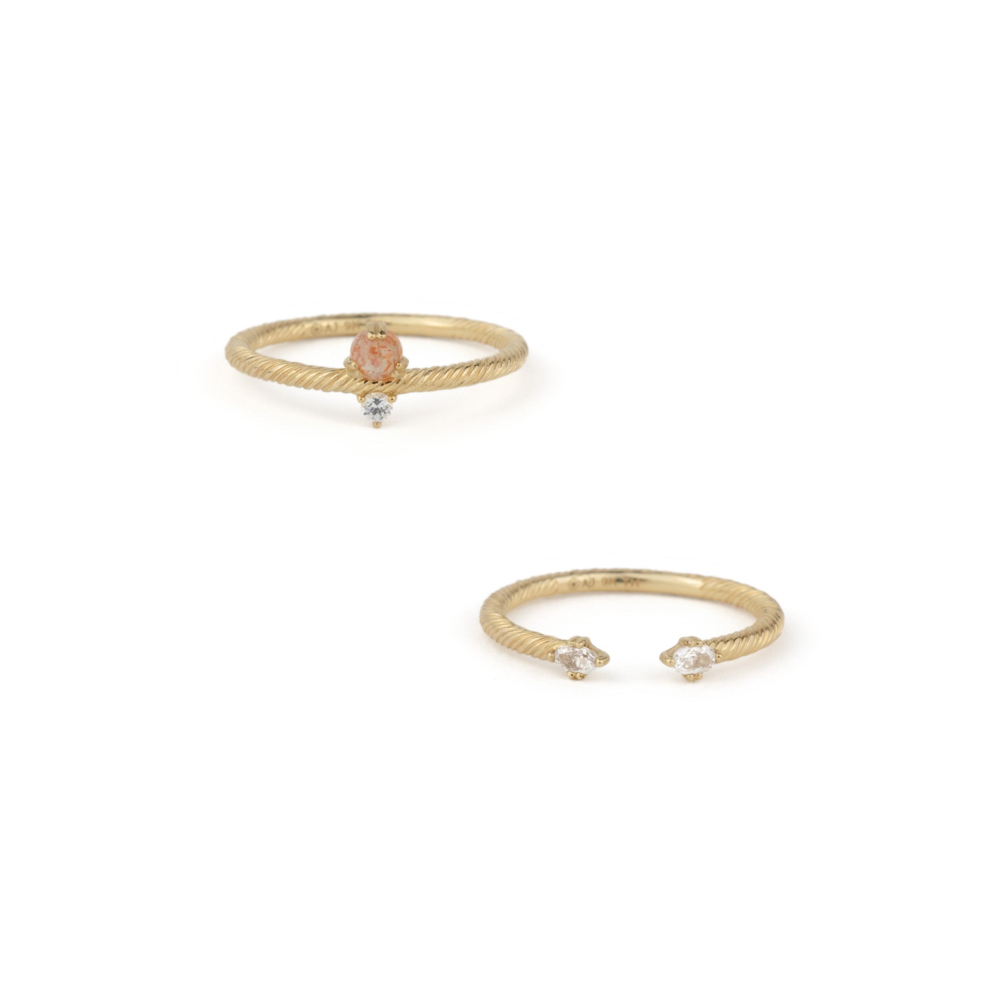 Minimalist solid gold ring stack with twisted texture in sunstone and white sapphire, displayed on white background.