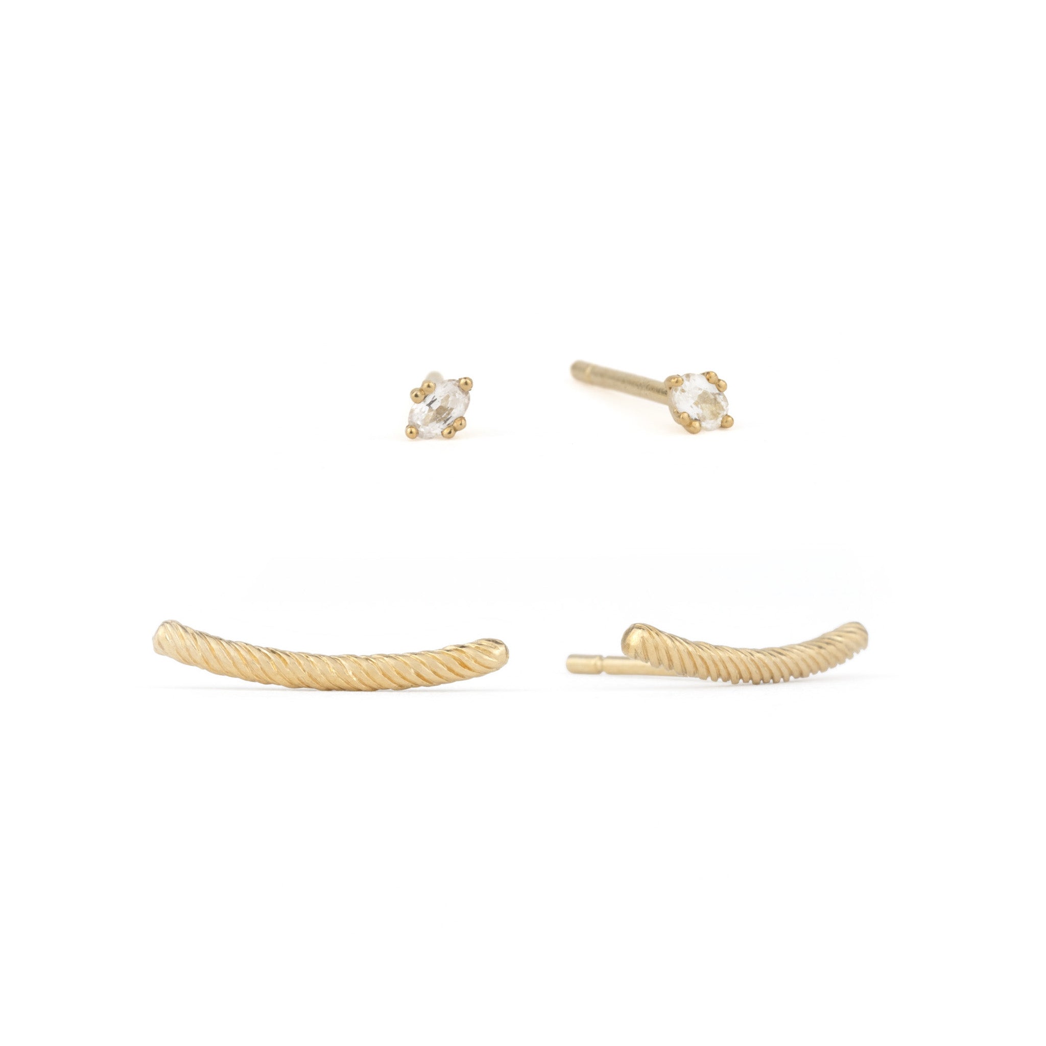 Tiny solid gold oval stud earrings in white sapphire and curved bar studs with twisted texture, stacked on white background.
