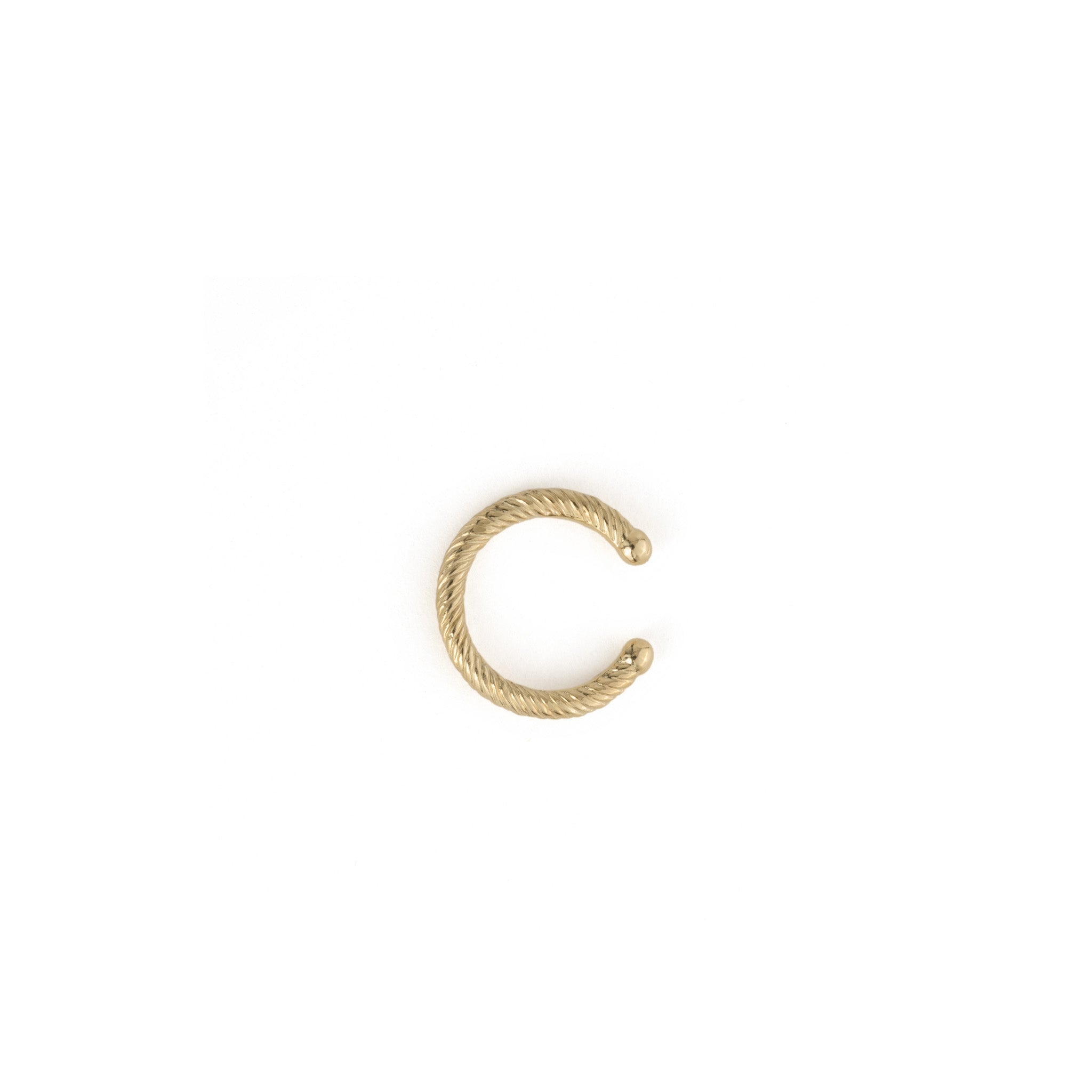Top view of solid gold ear cuff with twisted texture and open back with comfortable rounded ends, shown on white background.