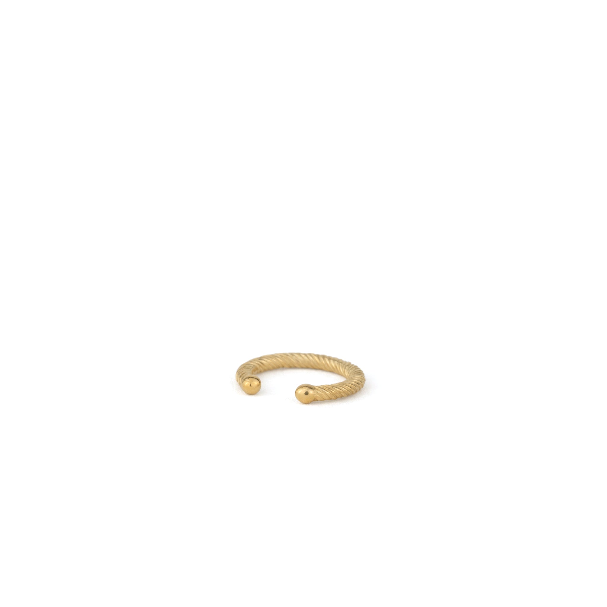 Angled back view of solid gold ear cuff showing comfortable rounded ends and twisted texture on white background.