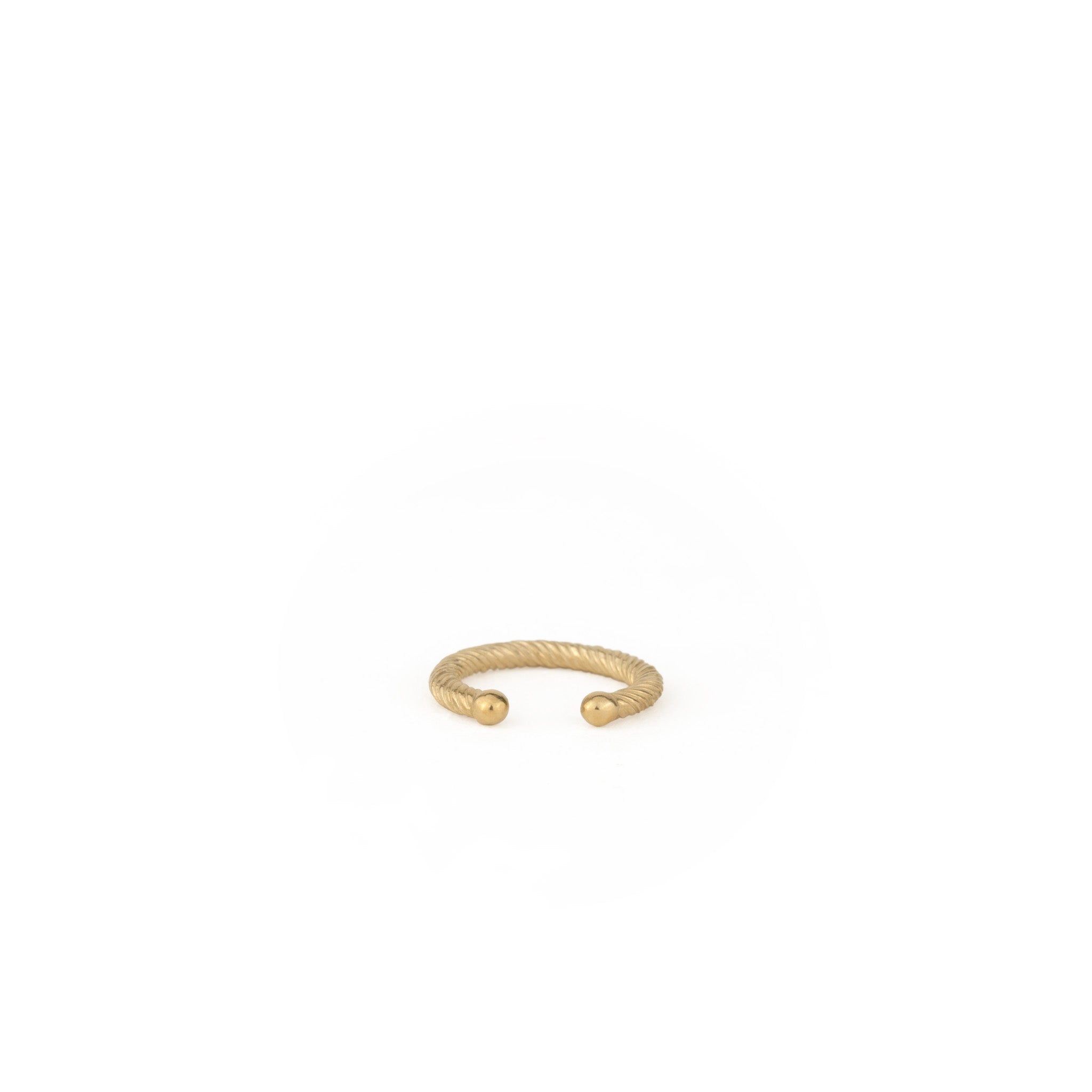 Back view of solid gold ear cuff showing comfortable rounded ends and twisted texture, displayed on white background.