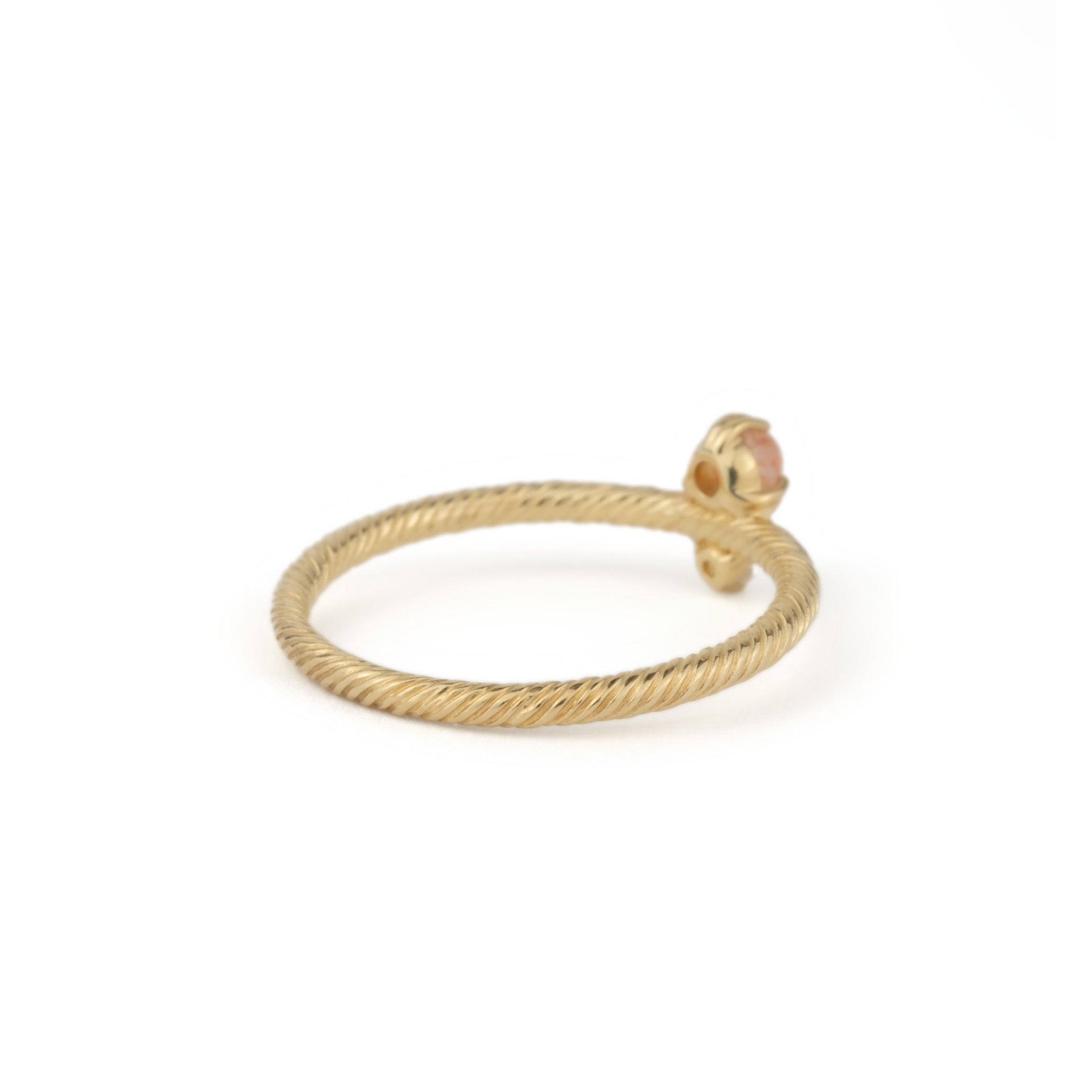 Back view of solid gold ring with twisted texture, sunstone, white sapphire, and minimalist design, on white background.
