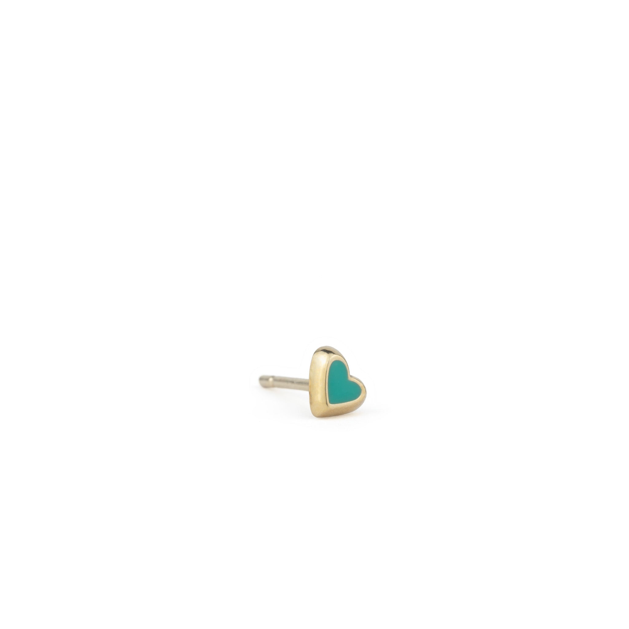 Angled view of solid gold tiny heart stud earring with teal enamel, displayed on white background.