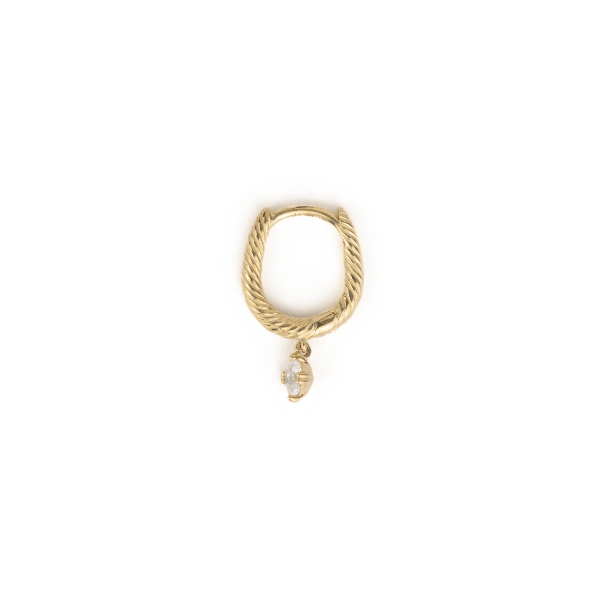Side view of solid gold huggie hoop earring with twisted texture and dangling oval white sapphire, shown on white background.