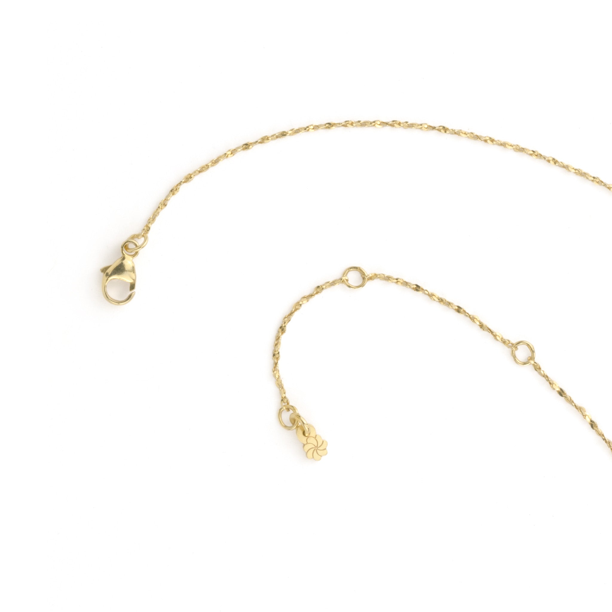 Close-up of lobster clasp on solid gold twisted serpentine chain necklace, showing adjustable length, on white background.