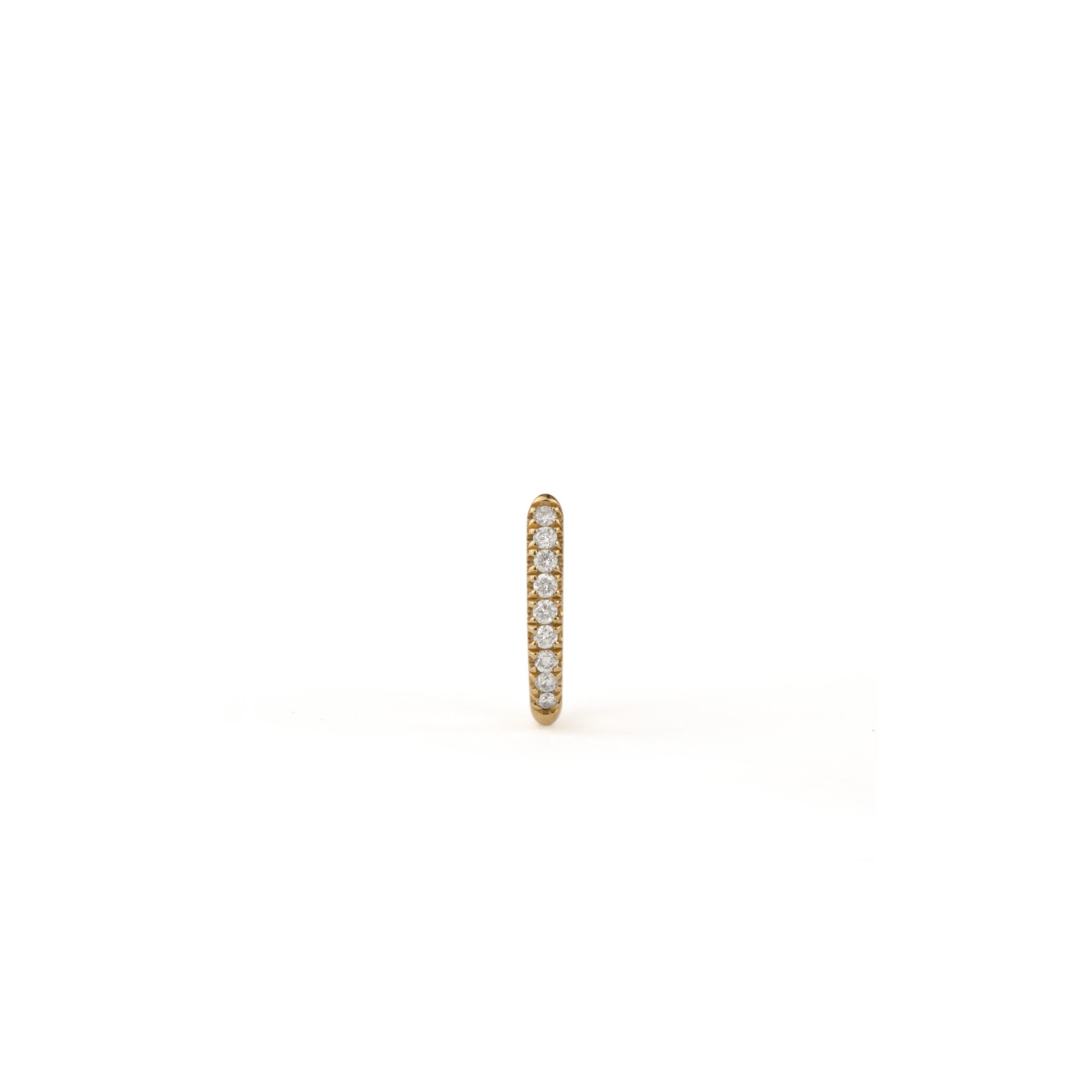 Solid gold huggie hoop earring with split-prong set brilliant white diamonds, in a minimalist design, on white background.