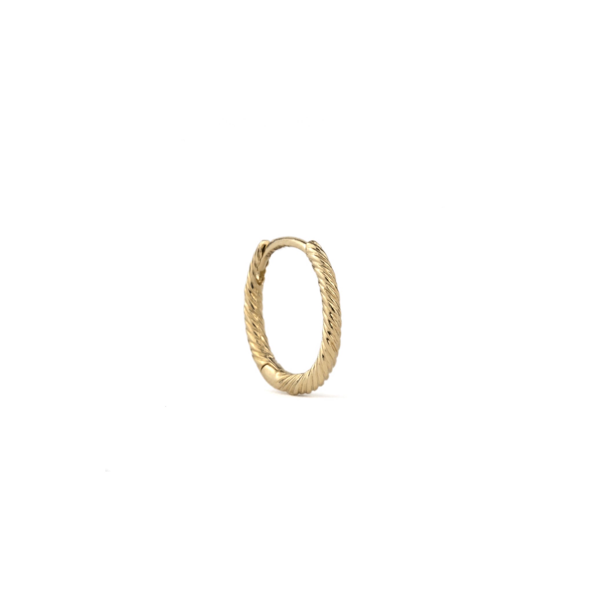 Oval solid gold single hoop earring with twisted texture and minimalist design, angled front view on white background.