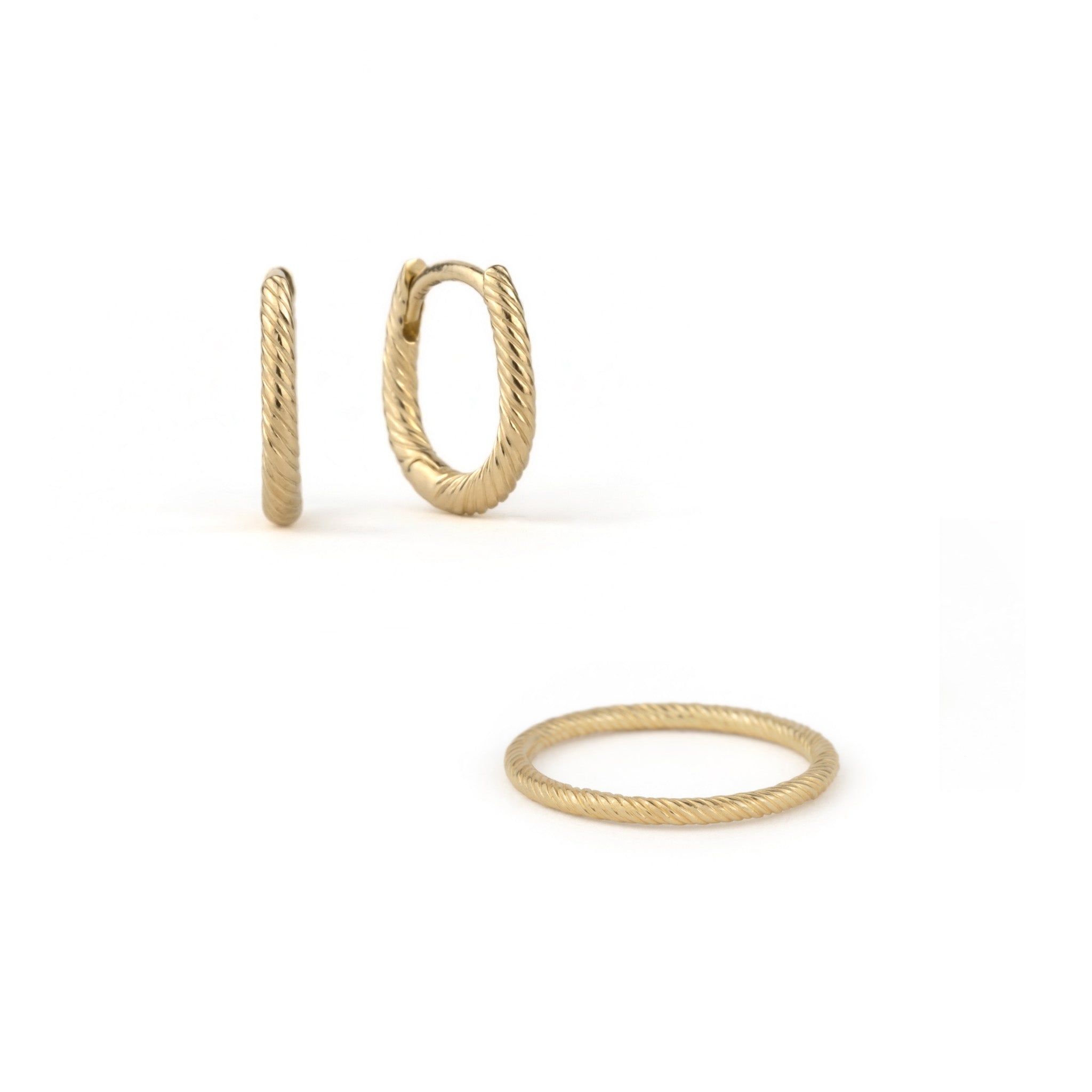 Solid gold ring and huggie hoop earrings set with twisted texture and minimalist aesthetic, displayed on white background.