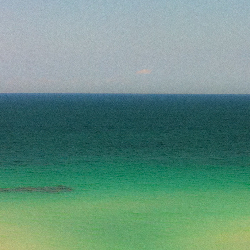 Sea-green Biscayne Bay water meeting blue sky on the horizon, natural color inspiration.