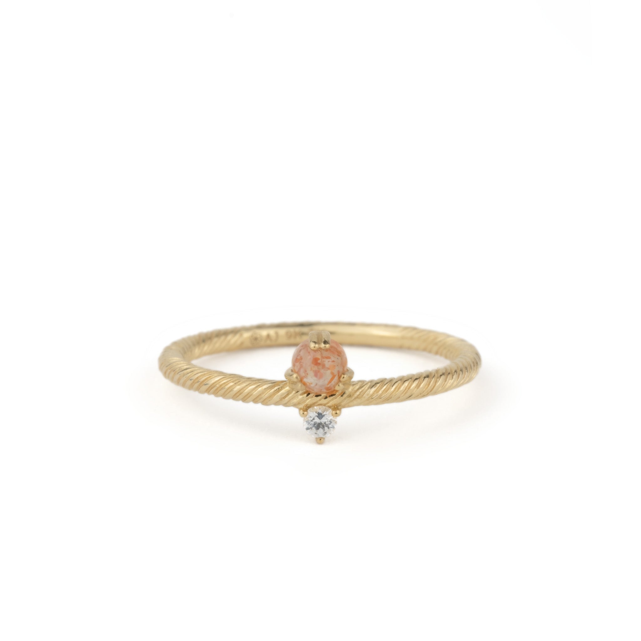 Solid gold ring with twisted texture, sunstone, white sapphire, and minimalist design, displayed on white background.