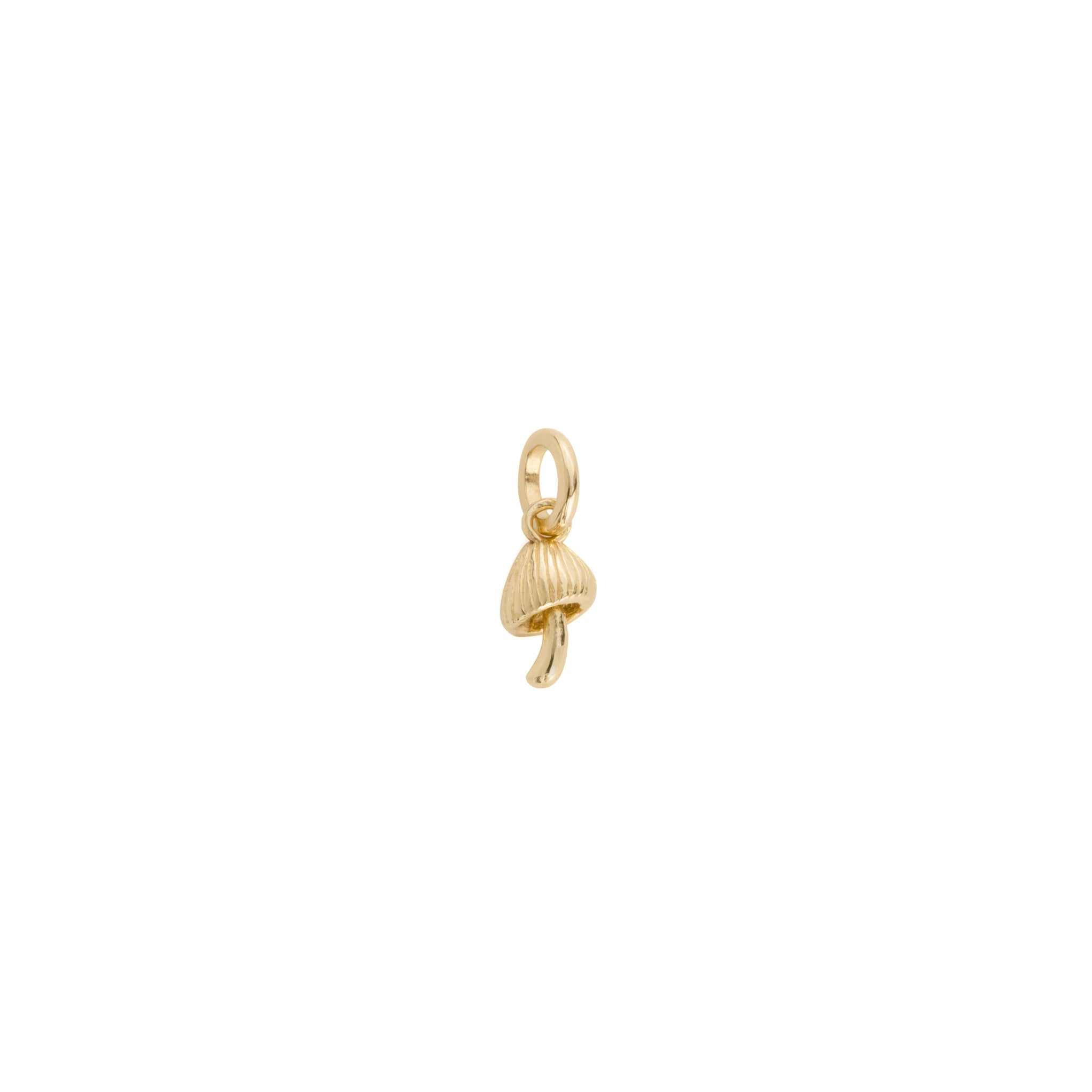Solid gold tiny mushroom charm pendant, in a minimalist design, displayed on white background.