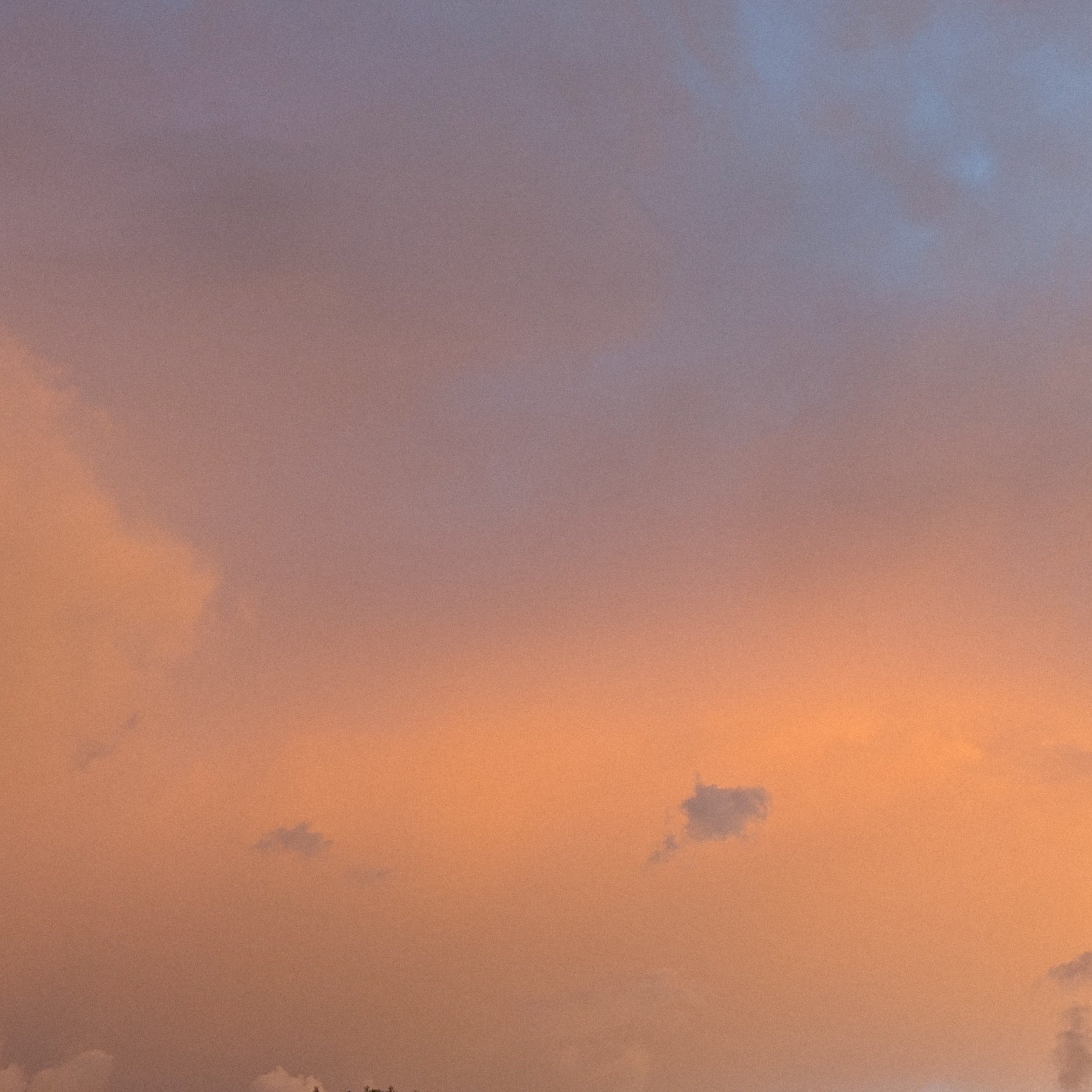 Glowing sunlit sky reflecting on soft clouds, natural color inspiration.