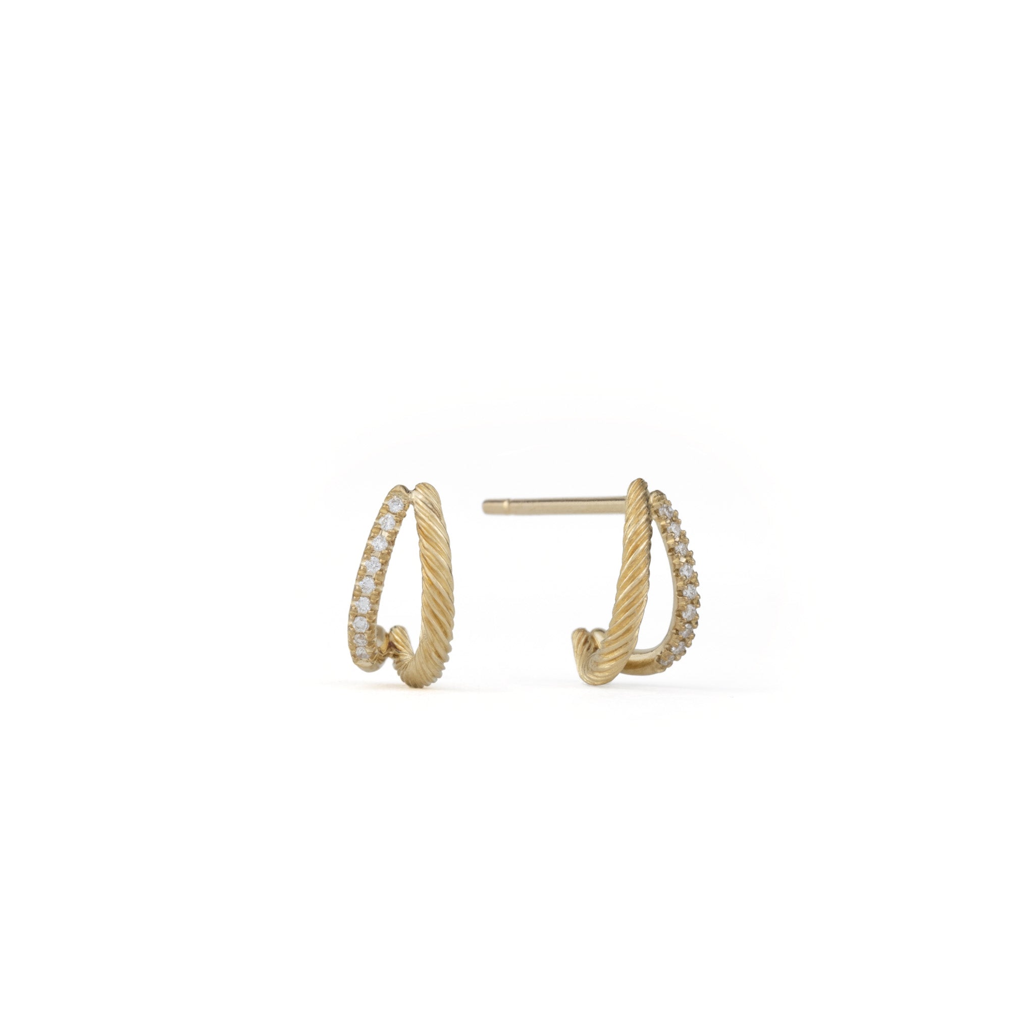 Minimalist solid gold double hoop earrings with posts, twisted texture, and brilliant diamonds, on white background.
