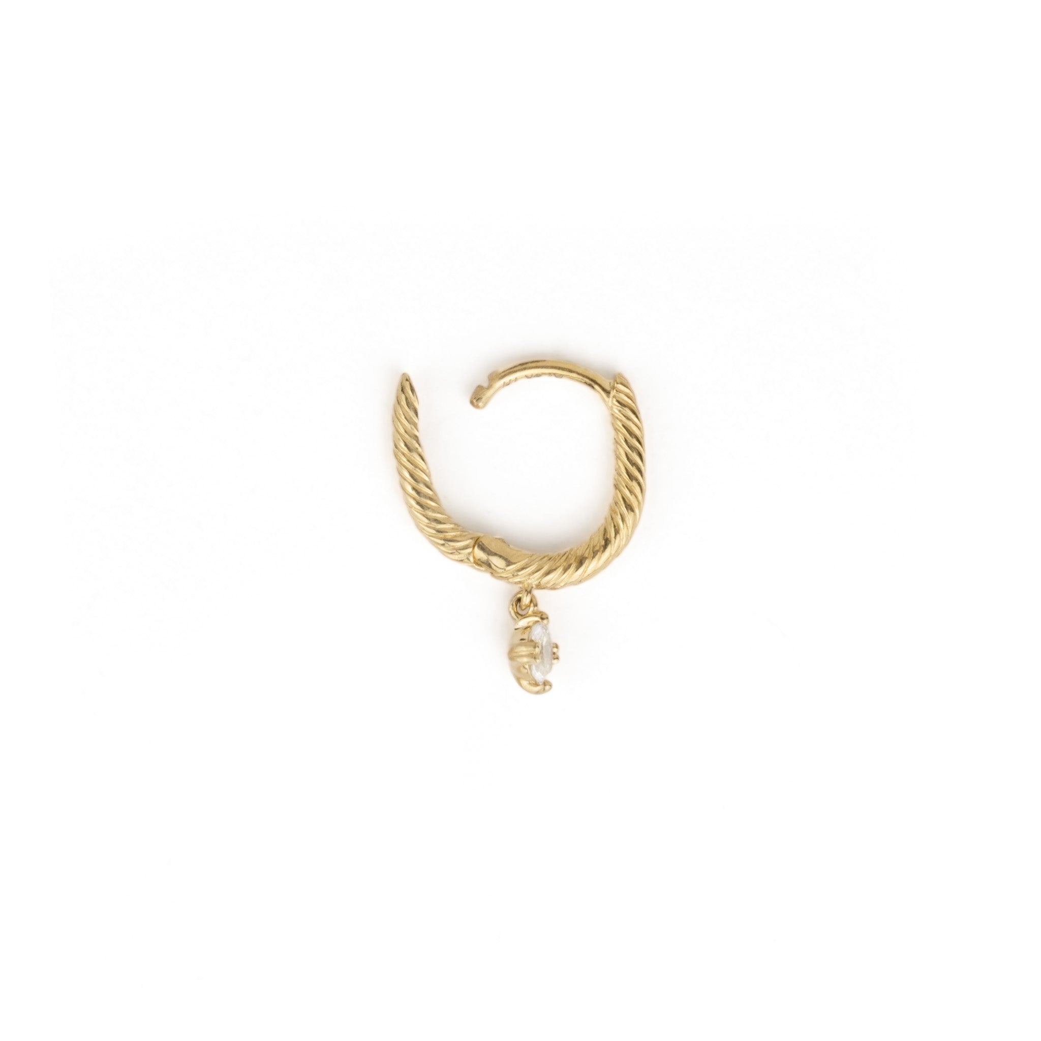 An Aiden Jae Starlight Huggie earring with a spiral design.