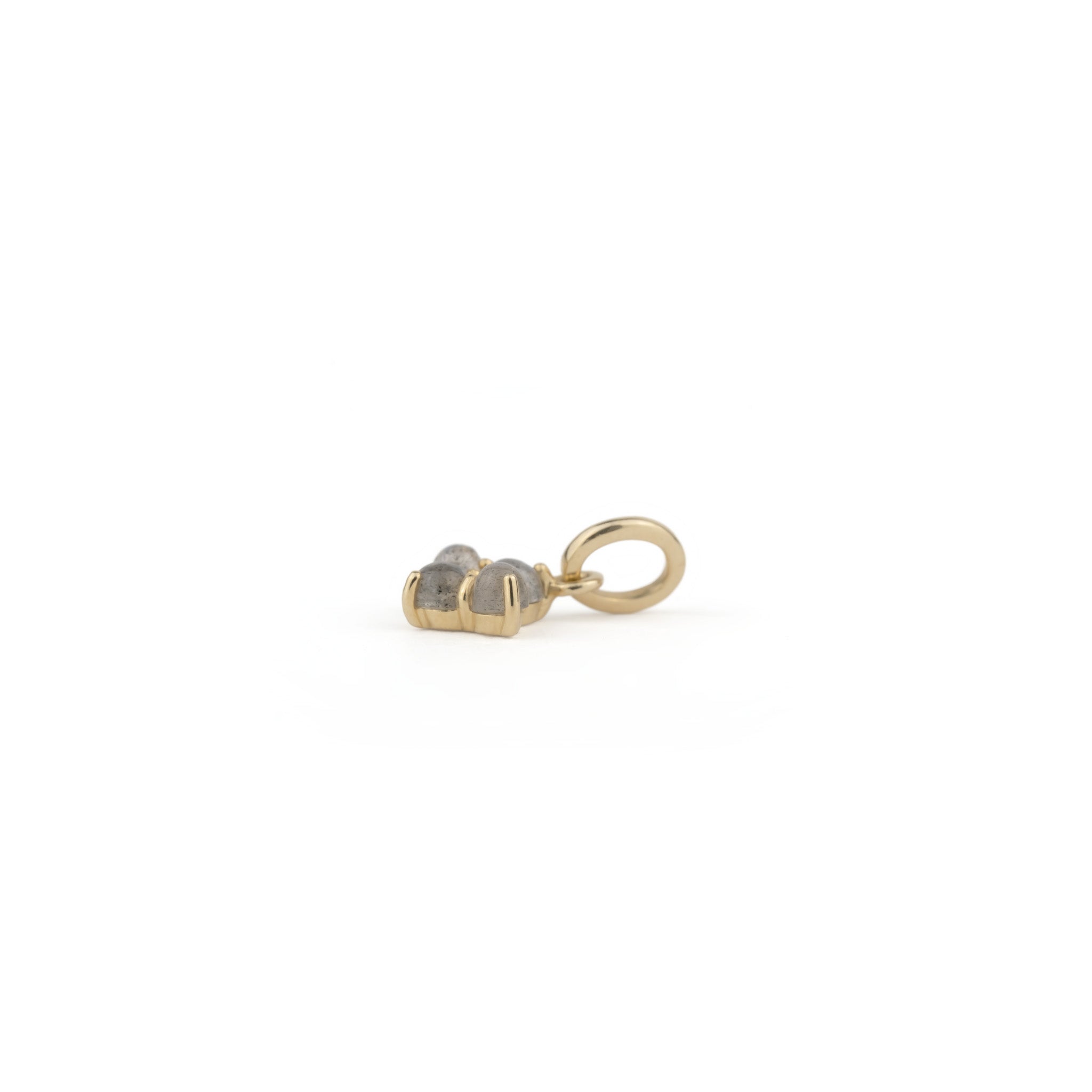 A yellow gold Sunrise Charm ring from Aiden Jae with two hearts on it.