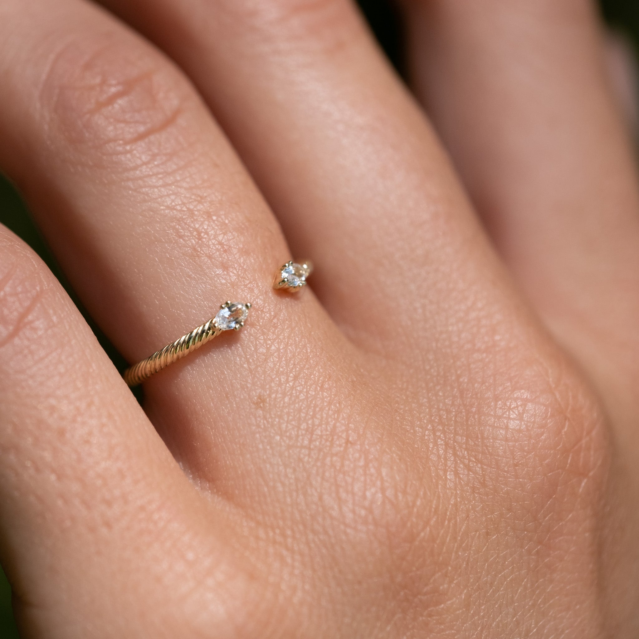 A woman's hand with an Aiden Jae Starlight Ring on it.
