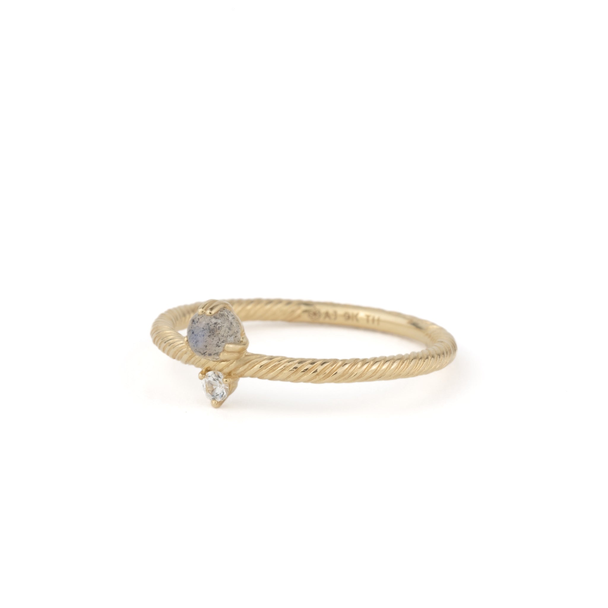 An Aiden Jae Daybreak Ring with a white diamond.