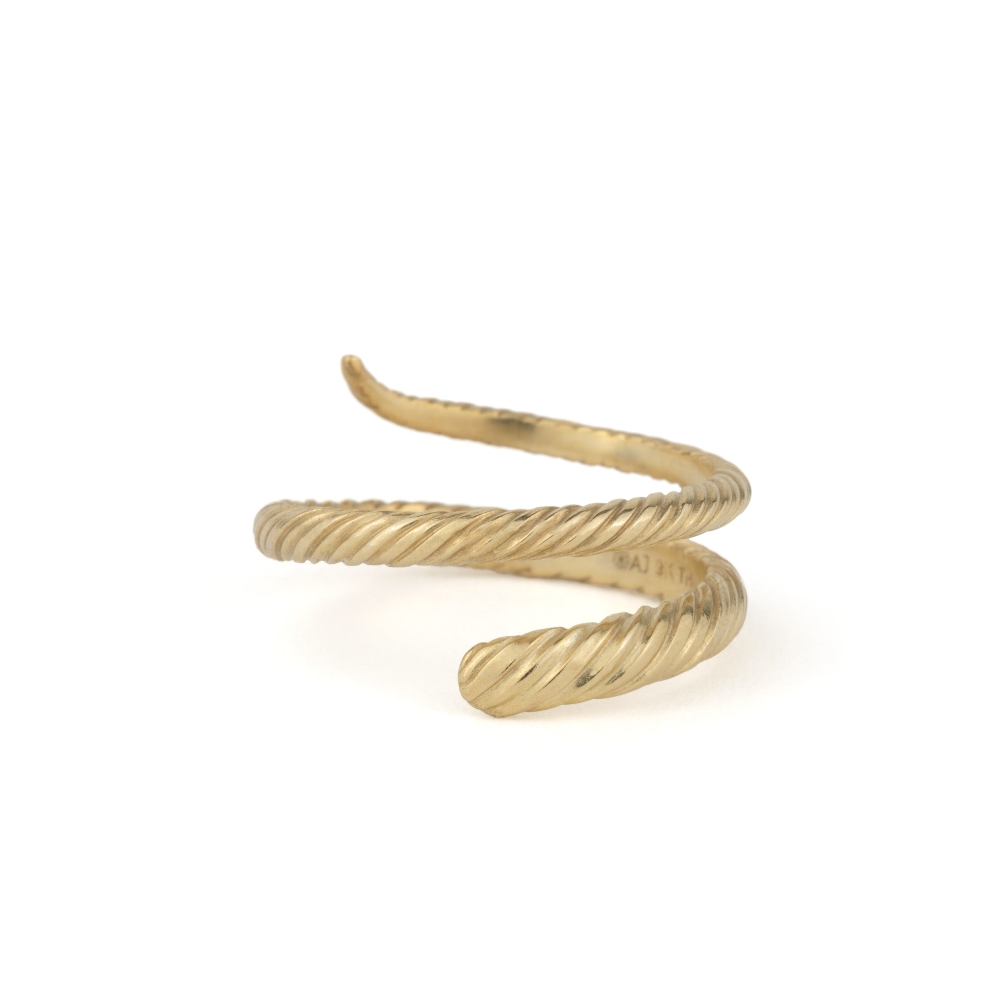 Solid gold wrap ring with twisted texture and minimalist design with snake-like form, displayed on white background.