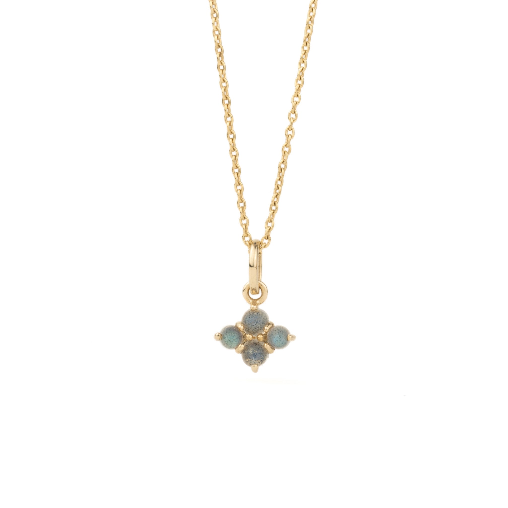 Solid gold small charm pendant with cabochon labradorites, in minimalist design, hanging on cable chain on white background.