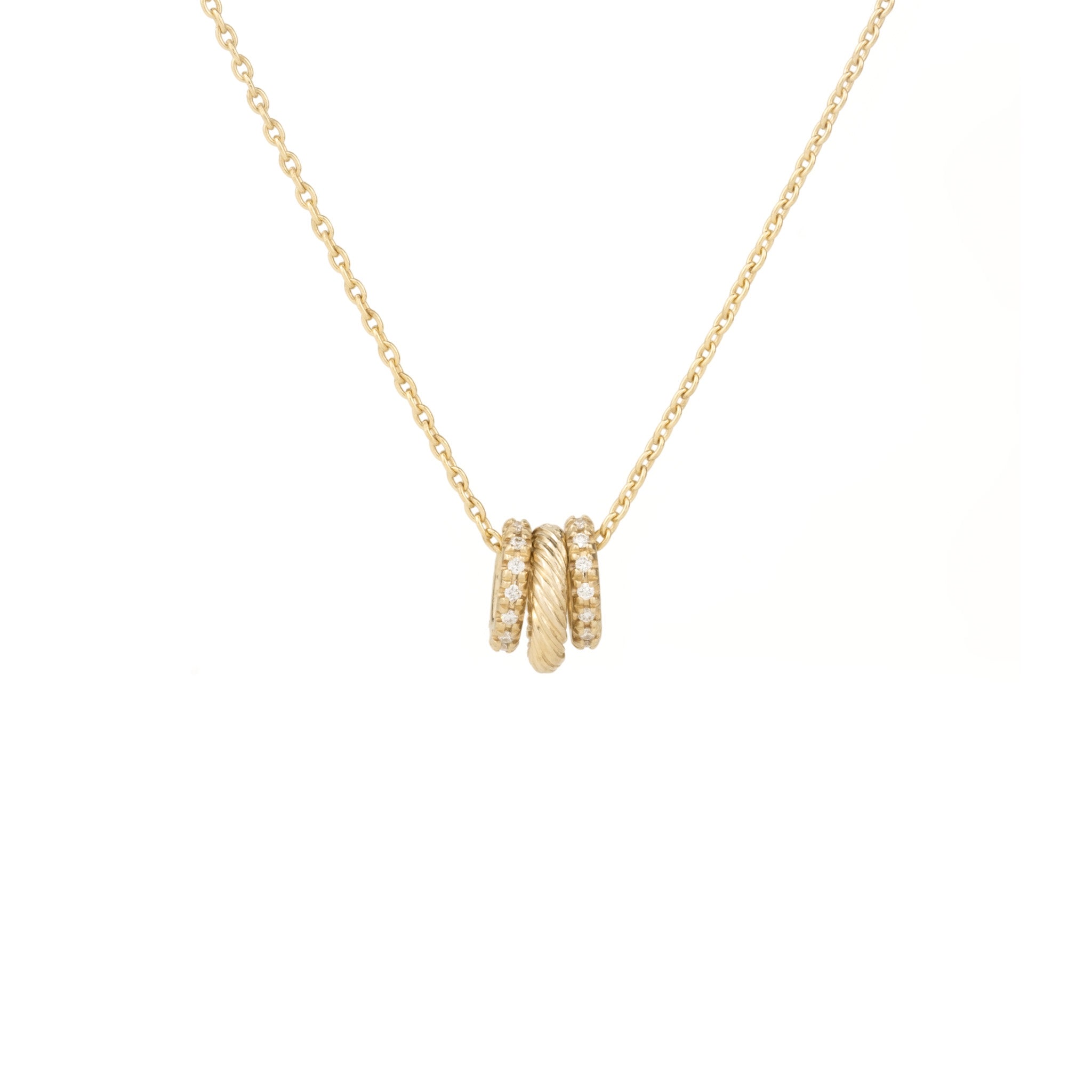 Solid gold necklace featuring textured and diamond oval link charms hanging on a cable chain, against a white background.